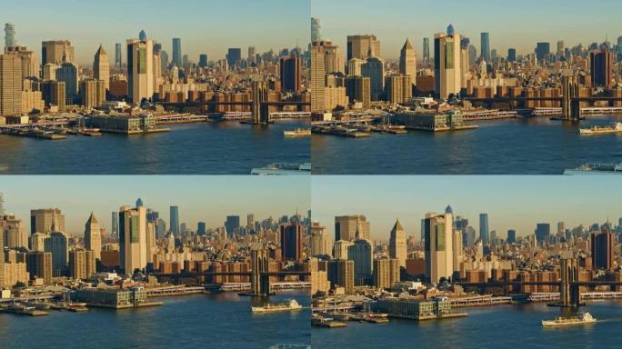 工业船与东河一起经过曼哈顿天际线和布鲁克林大桥。带有转发摄像机运动的无人机视频。