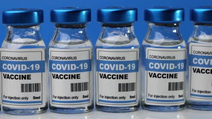 新型冠状病毒肺炎疫苗冠状病毒的疫苗接种瓶。注射瓶转动