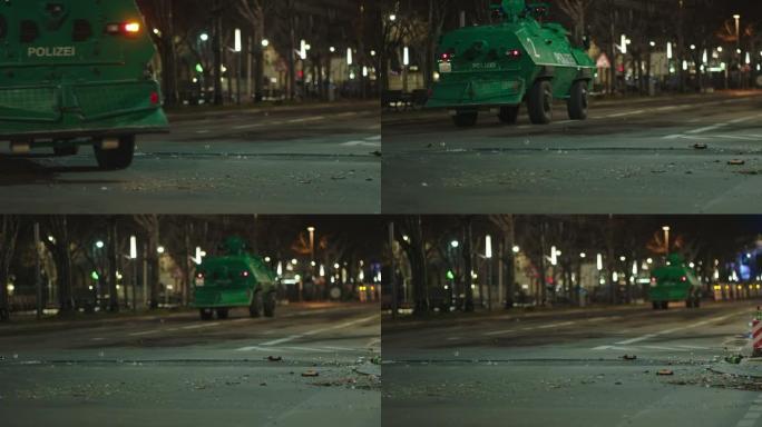 一辆绿色装甲运兵车经过拐角处，到达市中心的大街