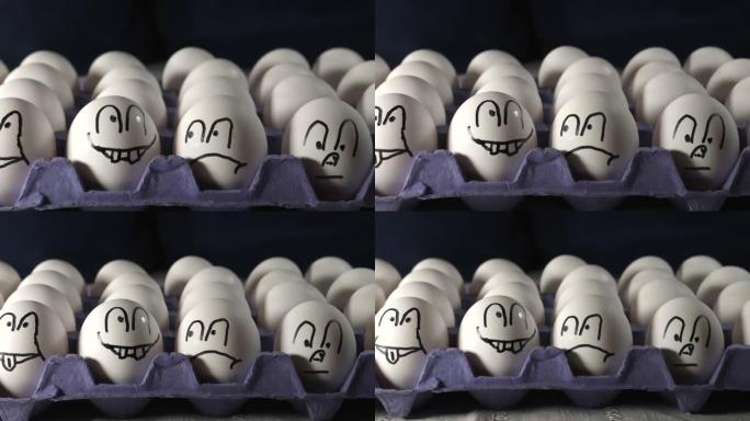 四张脸画在托盘上的白鸡蛋上