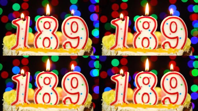 189号生日快乐蛋糕与燃烧的蜡烛顶。