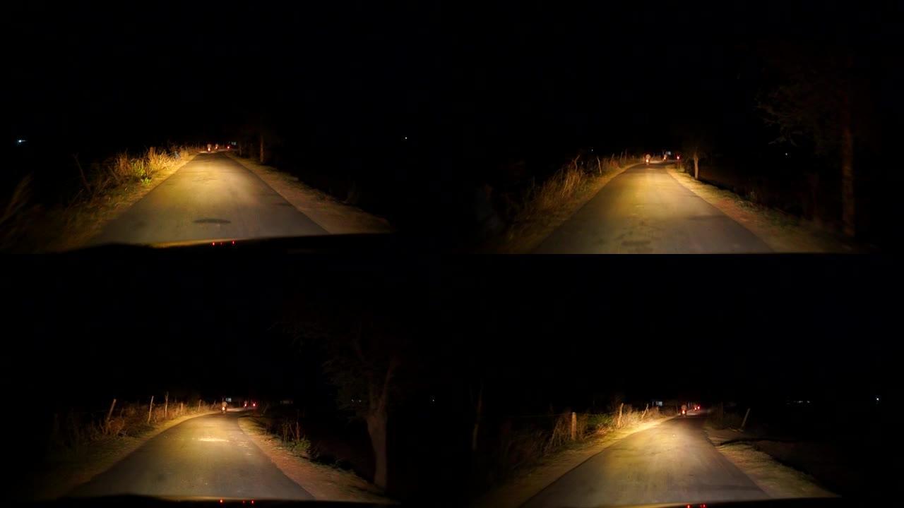 日落之后，晚上在高速公路上开车，交通很少。晚上，摄像头在前面，挡风玻璃参考。