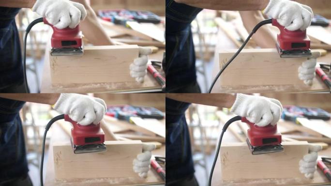 专业木匠使用砂光机，在车间用木头加工