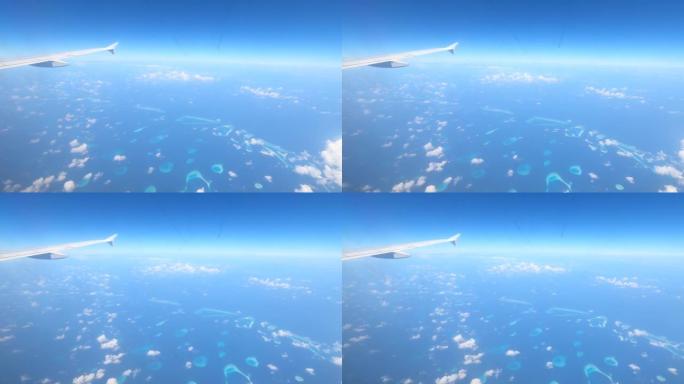 4k视频: 通过飞机窗口观看。马尔代夫从上面