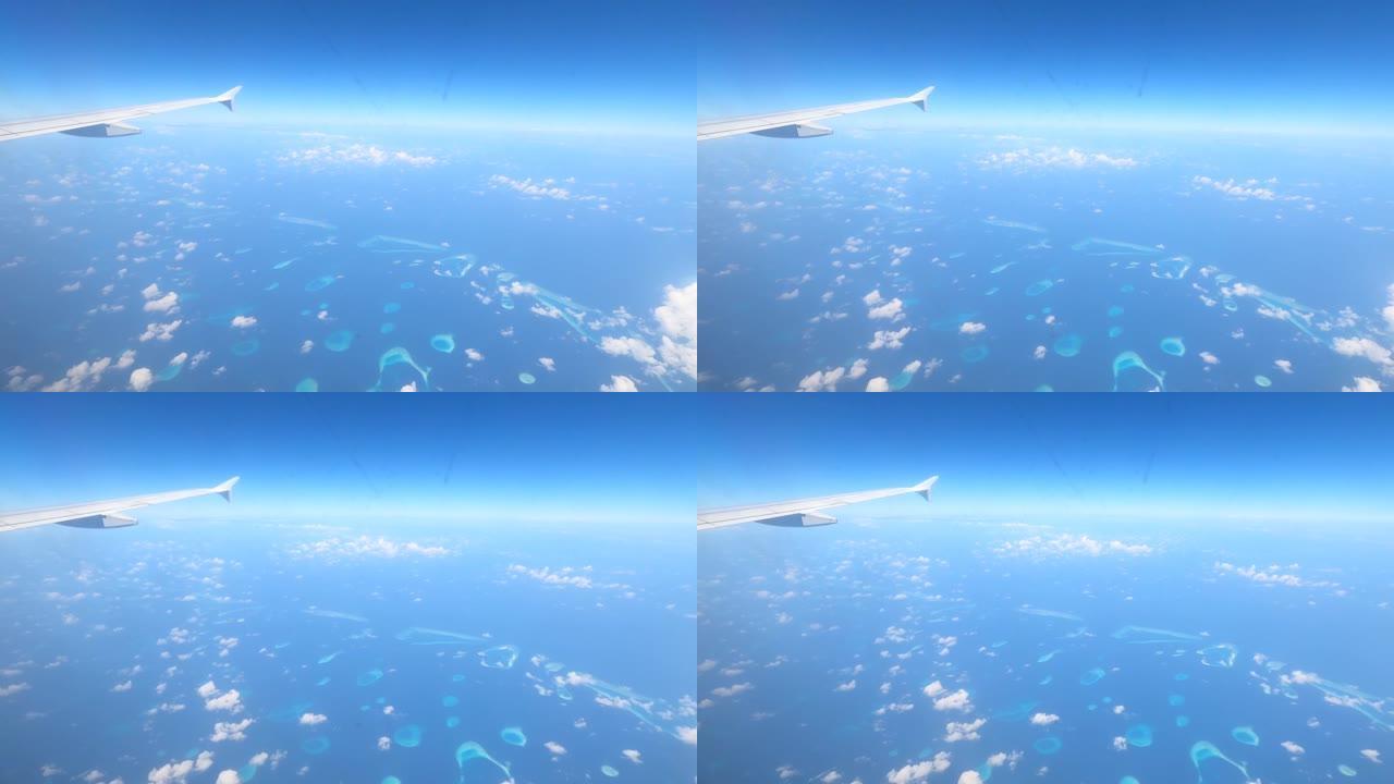 4k视频: 通过飞机窗口观看。马尔代夫从上面