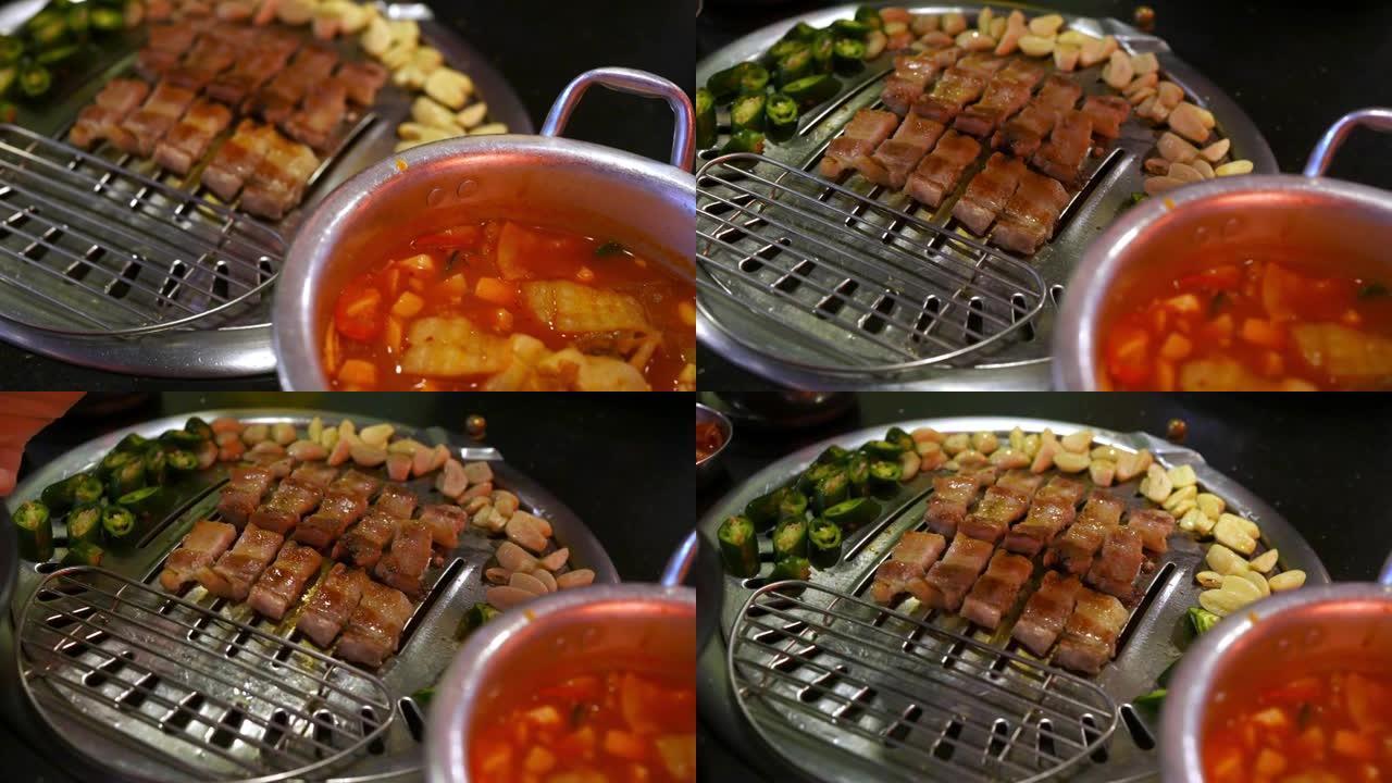 4k厨师手工烹饪韩式烧烤猪肚配大蒜青椒炭炉