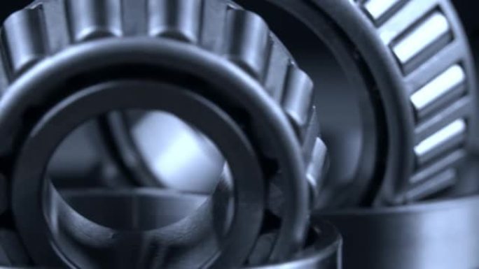 循环无缝视频，轴承在黑色背景的转盘上旋转。
