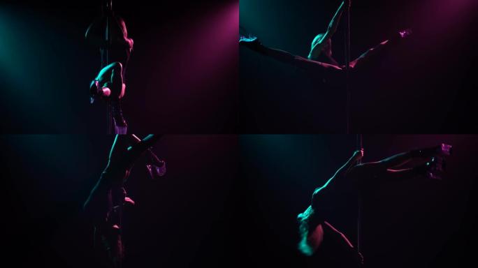 性感的金发女郎爬上杆子，使麻线和性下降。钢管舞。在黑暗的工作室拍摄，有烟雾和霓虹灯。明亮的蓝色和紫色