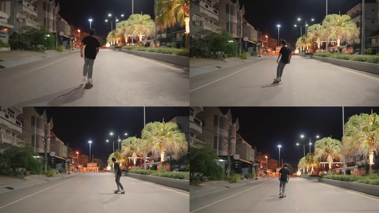 年轻人晚上在街上玩滑板
