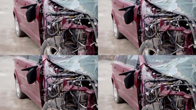 损坏和废弃汽车的特写镜头。在街上发生事故后，汽车被砸成碎片。粗心驾驶的概念