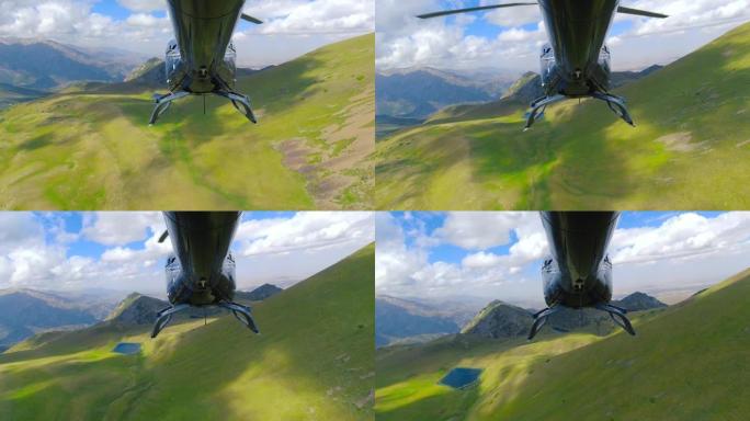 从尾部飞过新西兰高山景观的直升机视图。