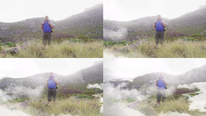 高加索高级男子站在乡村徒步旅行，越过快速移动的云层