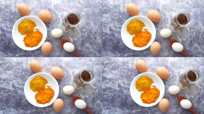 桌上鸡蛋和烹饪原料的俯视图