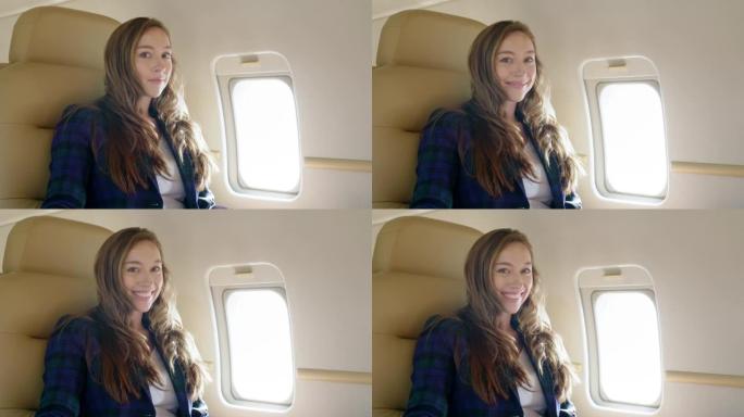 迷人的黑发女人在私人飞机上慢动作微笑