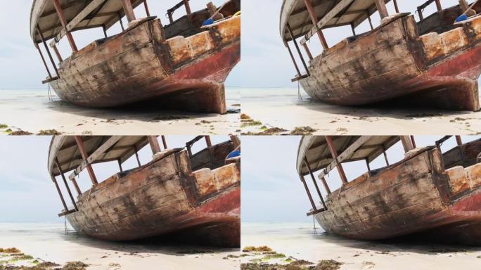 非洲渔船在退潮时搁浅在沙滩上的沙滩上，桑给巴尔