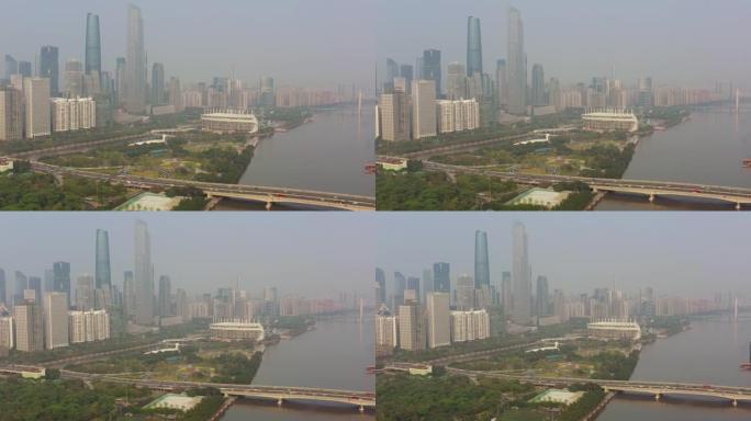 阳光灿烂的日子广州市市中心交通大桥著名体育场河畔空中全景4k中国