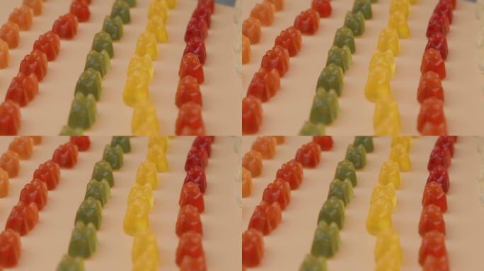 彩色熊形软糖软糖。不同种类软果冻哈里波糖果旋转的特写宏视频。
