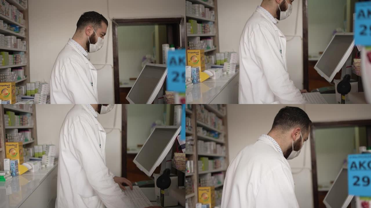 专门的男药剂师，在他的电脑上检查用药量