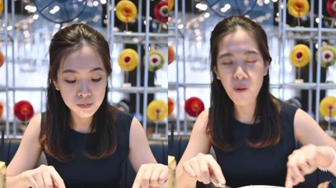 垂直镜头快乐亚洲华人泰国快乐微笑享受吃奢华亚洲美食快乐快乐情感