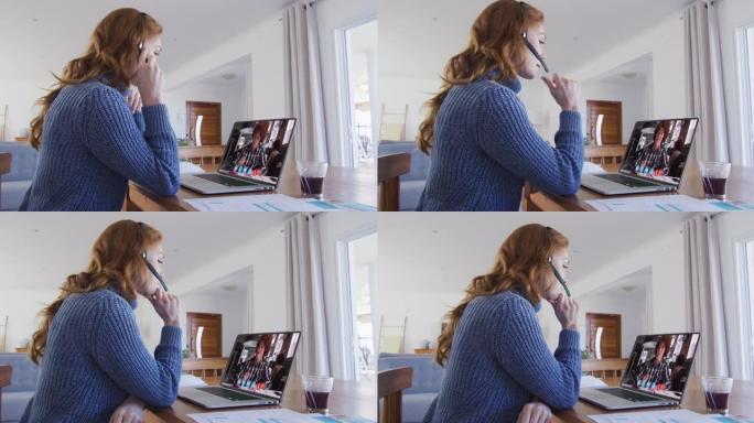 高加索女教师在家中与男大学生在笔记本电脑上进行视频通话