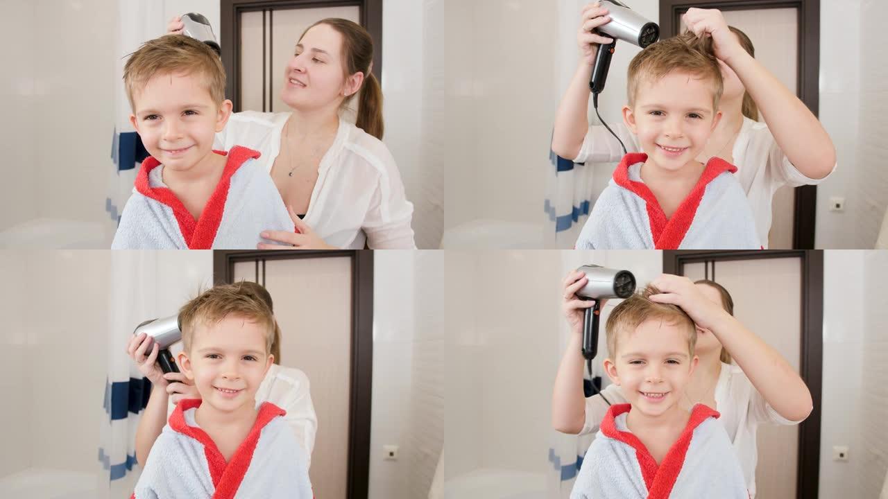 洗完澡后，母亲和小男孩用吹风机吹干头发的肖像。儿童卫生和家庭保健的概念。家里有爱心的父母和孩子