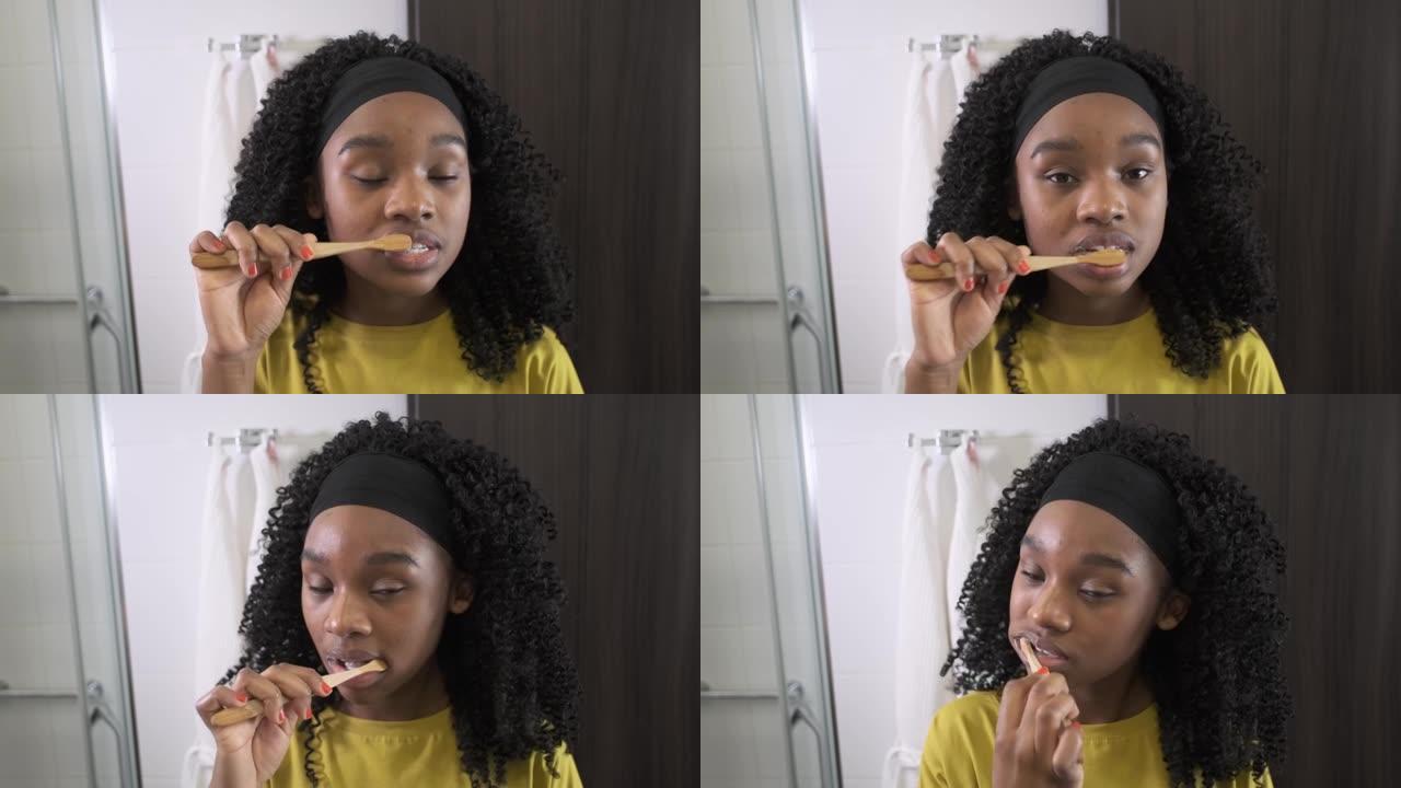 黑人女孩刷牙。酒店。