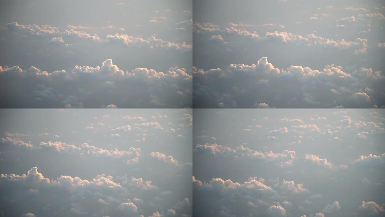 日出时飞越云层，从飞机驾驶舱看