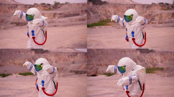 穿着太空服的女人在沙漠地区探索火星时，慢动作跳舞，表现出积极的情感和幸福，梦想着人类与水源，生命相遇