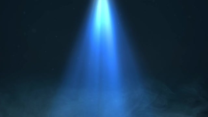定向聚光灯光束通过烟雾和粒子发出蓝色。
