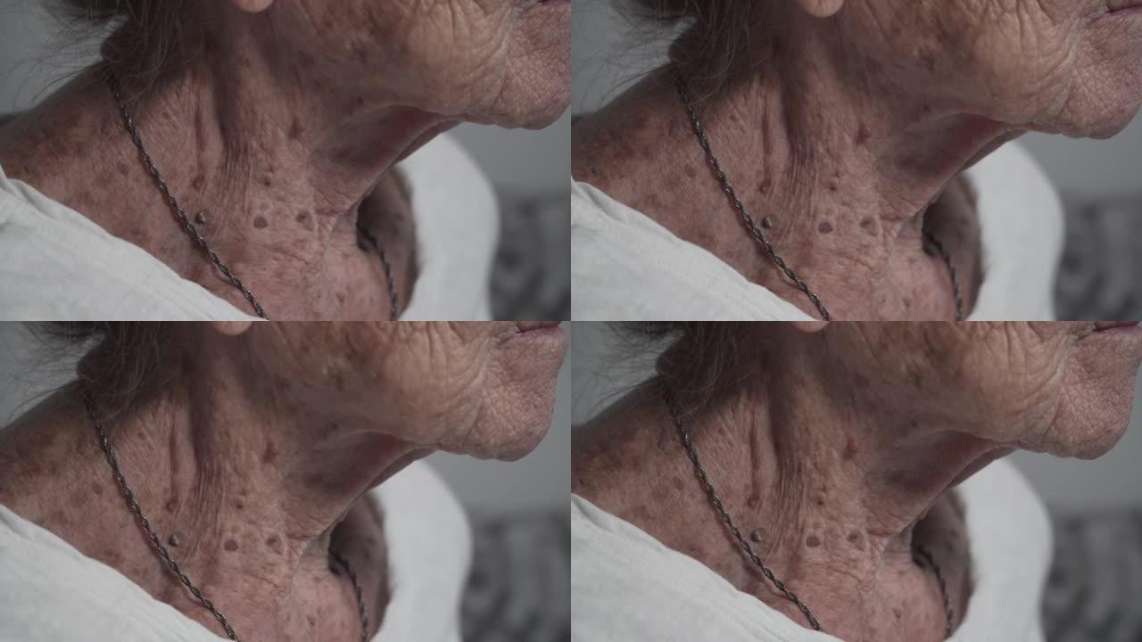 90岁高龄女性颈部特写脉搏。患有高血压的搏动动脉。主题老年心血管系统疾病。高血压。心脏循环系统
