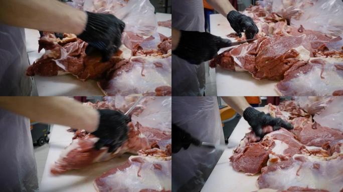 屠夫用刀割肉。切掉肉块。特写