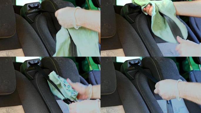 一块布用于清洁已经闲置了几个月的汽车安全带上的霉菌