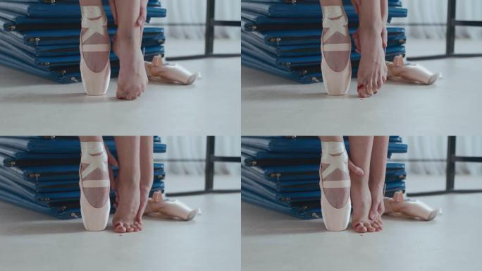 芭蕾舞女演员在训练后按摩受伤的脚