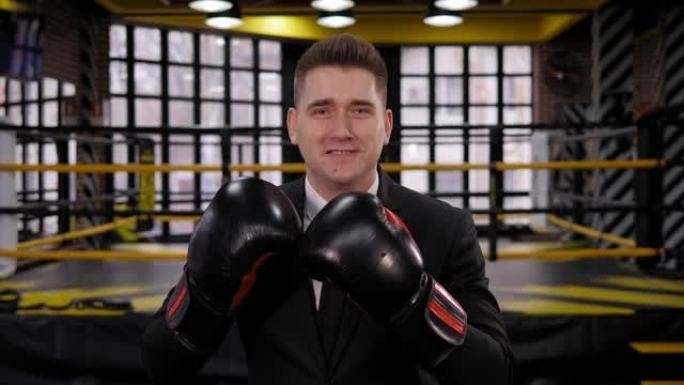 一个快乐的商人在拳击场上戴着拳击手套的肖像。