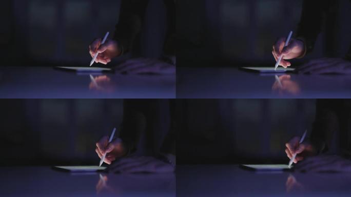 一个男人用数字笔和平板电脑在互联网上打字和搜索东西的特写镜头