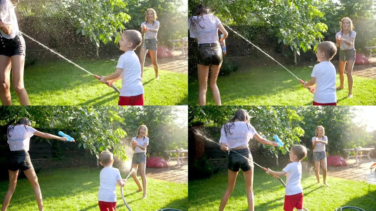 4k快乐的青少年和儿童玩水枪和花园软管并在后院进行水战的视频