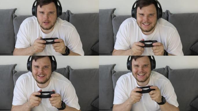 男子在游戏机上玩电子游戏不同的情绪愤怒的幸福