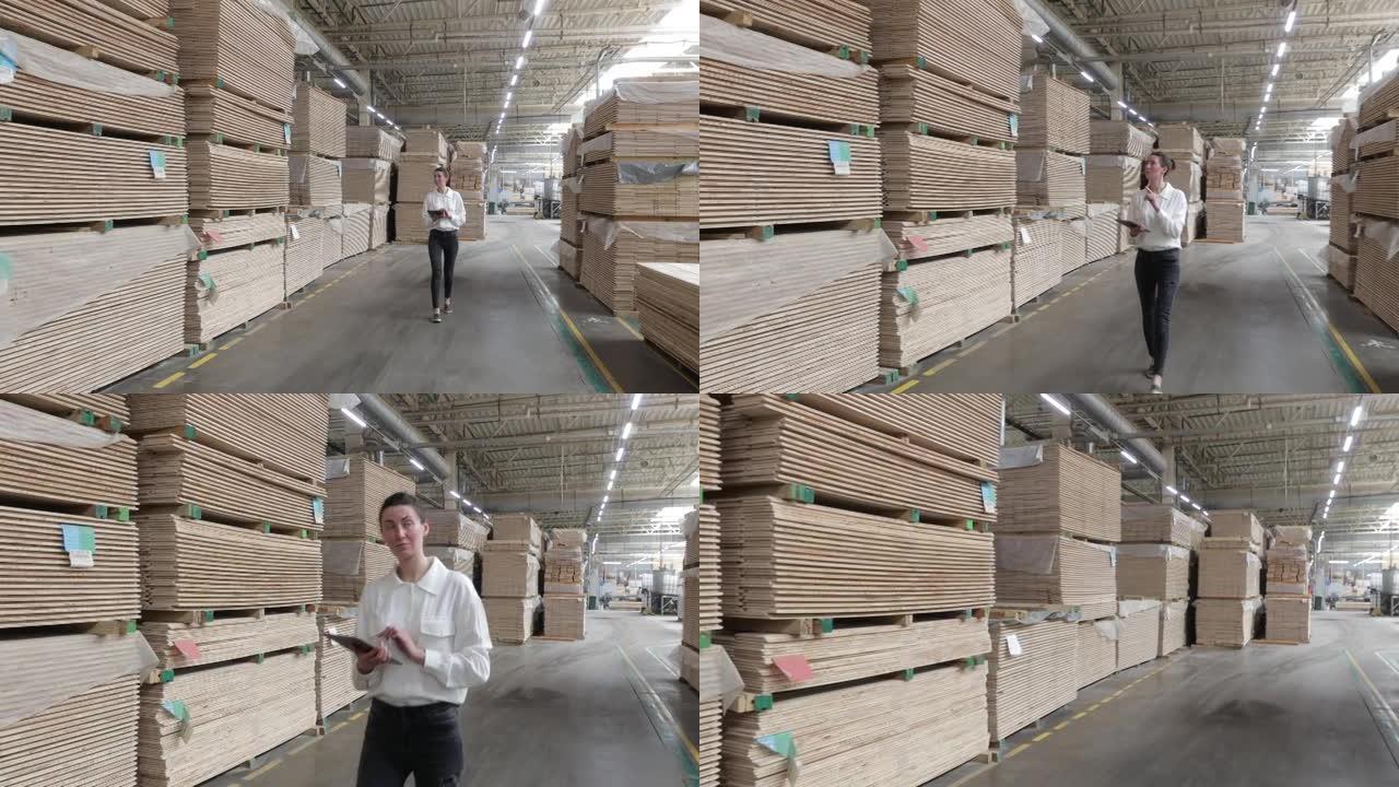 工业木工工厂的女商人-用现代机器生产木板