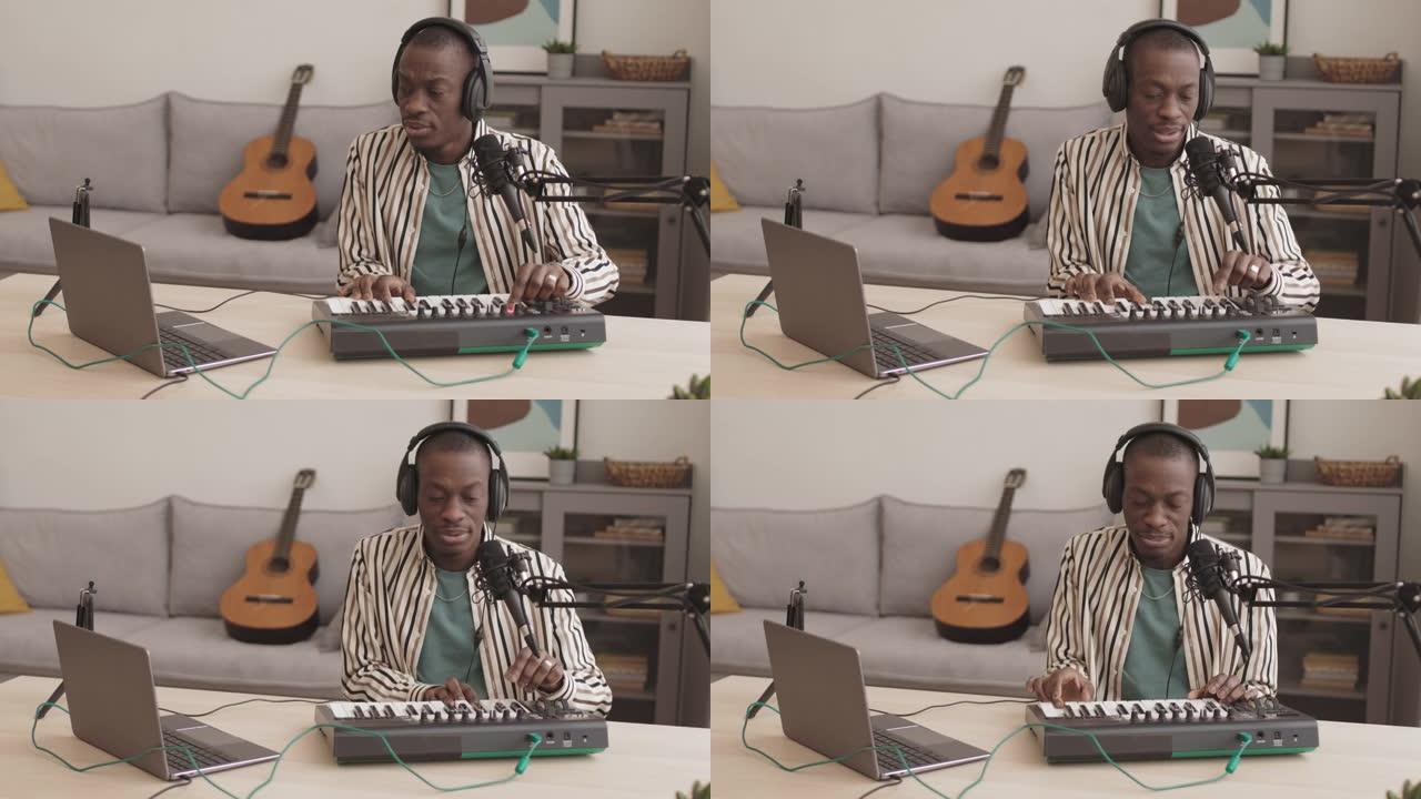 非洲年轻人在家玩Midi键盘合成器