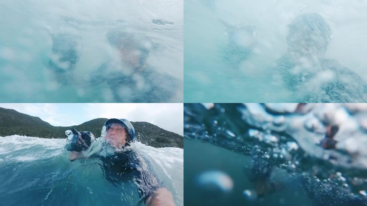 冲浪摄影师。戴着蓝帽子的人带着动作相机在波涛汹涌的大海中游泳，并通过波浪