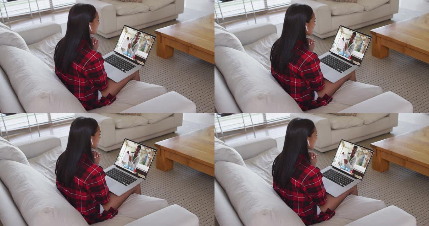 非裔美国女教师在家里的笔记本电脑上与男大学生进行视频通话