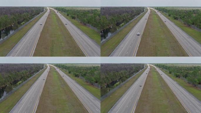 鳄鱼巷-大沼泽地大路高速公路，佛罗里达州，被沼泽和森林包围。无人机制作的带有转发摄像机运动的视频剪辑