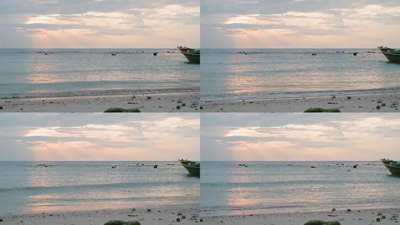 清晨日出时沙滩上的海水波浪天空自然背景长船尾