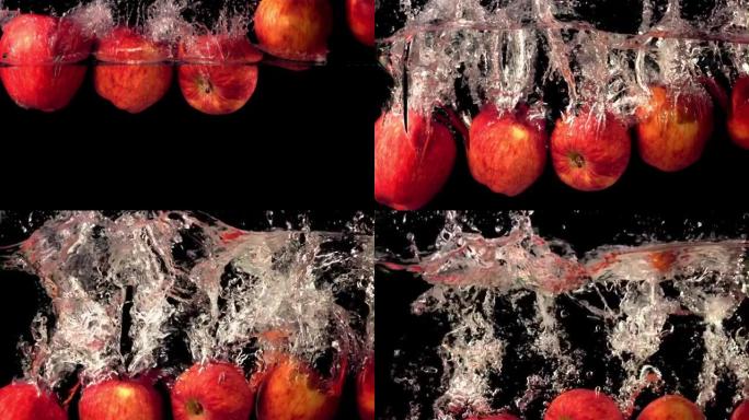 超级慢动作的新鲜苹果溅入水面。以1000 fps的高速相机拍摄。