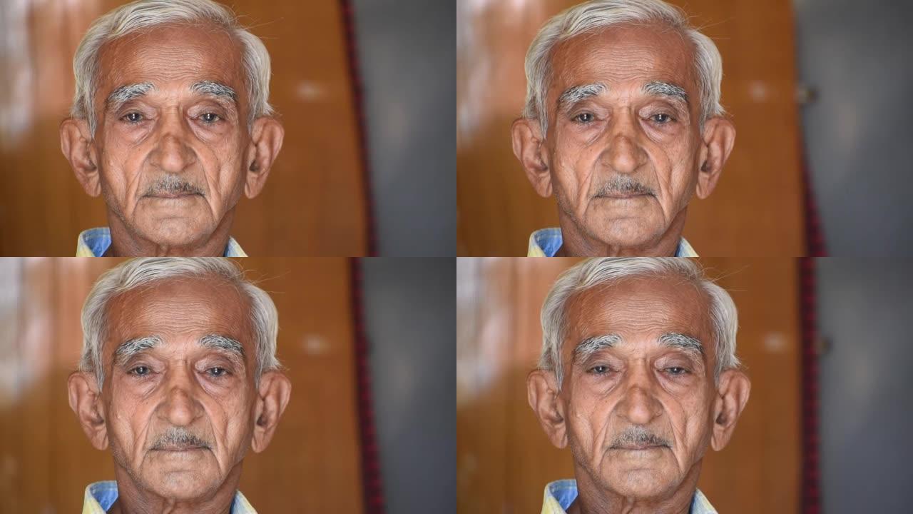 资深印度老人盯着镜头