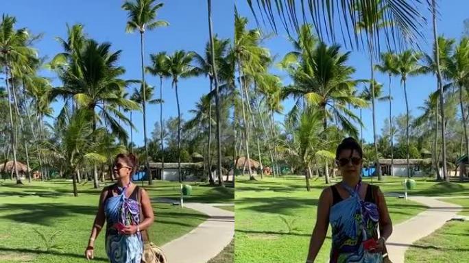 巴西妇女在棕榈树区行走