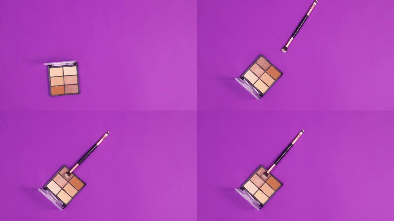 眼影调色板出现在紫色背景上，并带有化妆刷。停止运动