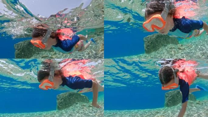 女孩在热带海洋水下浮潜