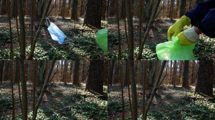 森林树枝上的医用防护口罩。冠状病毒的后果 (新型冠状病毒肺炎)。生态污染，医疗垃圾概念。志愿者清理公