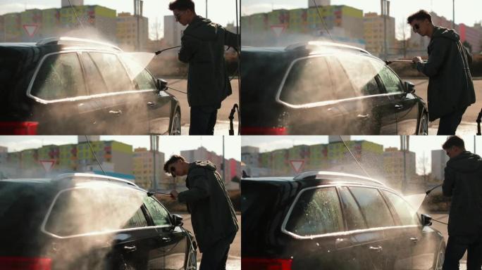 男子洗门窗汽车水它用水压洗掉干污垢